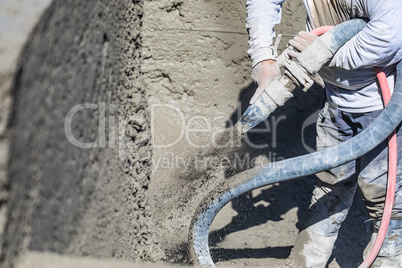 Pool Construction Worker Shooting Concrete, Shotcrete or Gunite