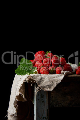 fresh ripe red strawberries on a gray linen napkin