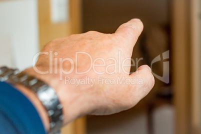 Man's hand with outstretched index finger