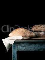 baked loaves of bread on a wooden table