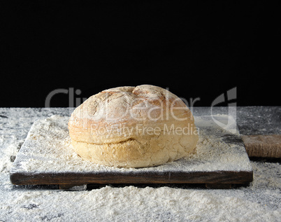round baked bread and white wheat flour