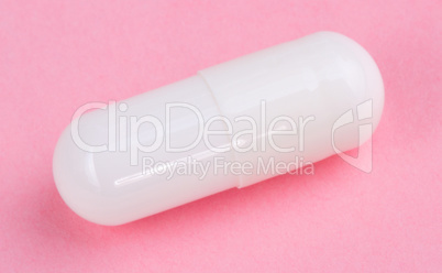 White Pill on Pink Background