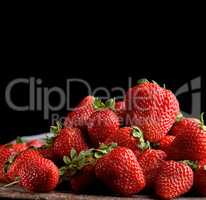 bunch of fresh ripe red strawberries on a  wooden table