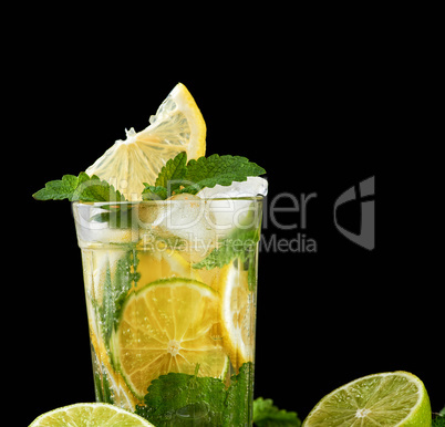 summer refreshing drink lemonade with lemons, mint leaves, ice c