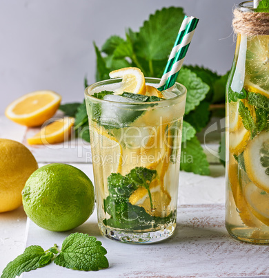 summer refreshing drink lemonade with lemons, mint leaves, lime