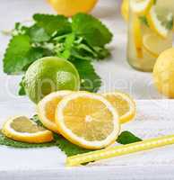 fresh lemon and lime slices on a wooden board