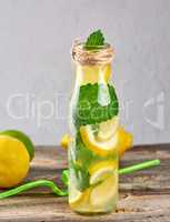 summer refreshing drink lemonade with lemons, mint leaves, lime