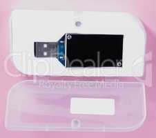 electronic device in plastic case on pink background at day