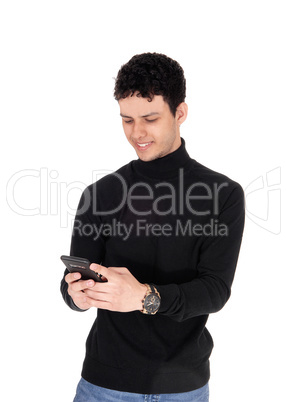 Happy young man smiling over the message on his phone