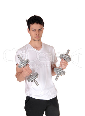 Young man exercising with two dumbbells