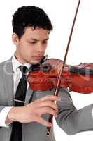 Close up of young man playing the violin