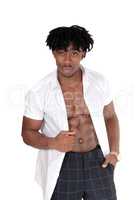 Black man standing in the studio with his shirt open