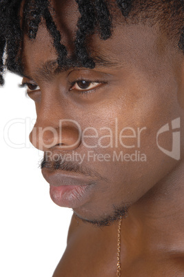 A close up portrait of the face of a black man without an shirt