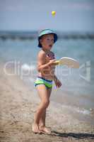 Playful boy on the beach. Fun on summer vacation
