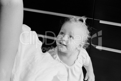 Home portrait of baby girl in black and white