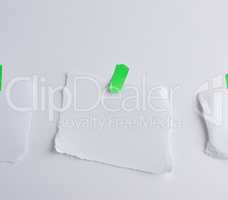 torn off white piece of paper glued to green velcro