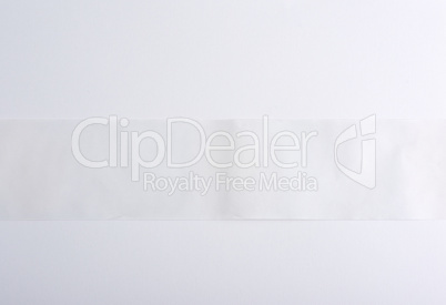 white strip of paper on a white background