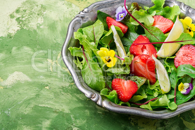 Bowl of salad with strawberry