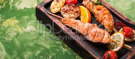 Grilled salmon on cutting board