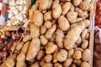 A closeup of potatoes in wooden boxes