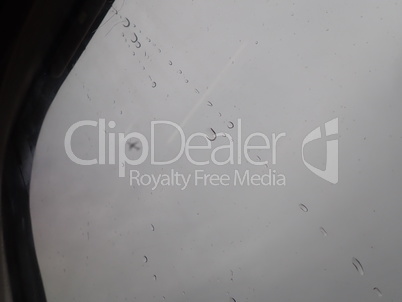 Car window with rain streaks