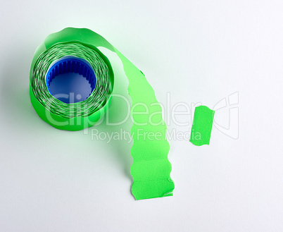 coil with green empty sticky price tags on white background