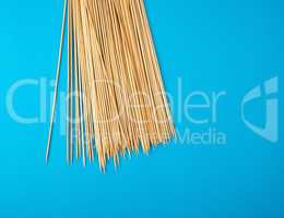 wooden bamboo chopsticks on a blue background