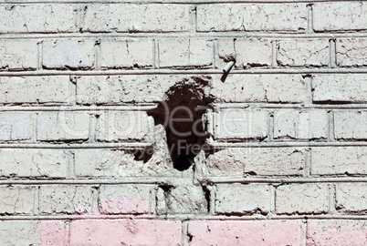 red brick wall background  with black hole