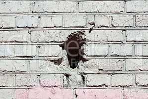 red brick wall background  with black hole