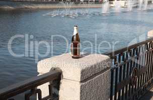 bottle on fence