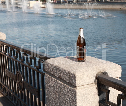 bottle on fence