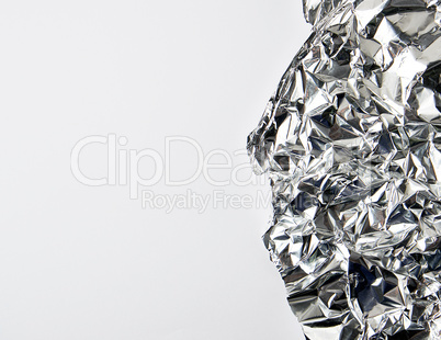 piece of crumpled foil on a white background