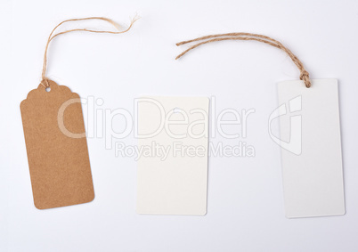 empty paper round and rectangular brown tag on a rope