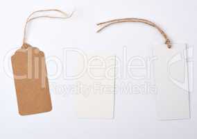 empty paper round and rectangular brown tag on a rope