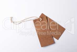 empty paper brown tag on the rope, white background