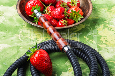 Smoking hookah on strawberry