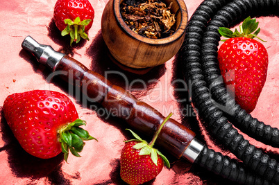 Smoking shisha on strawberry
