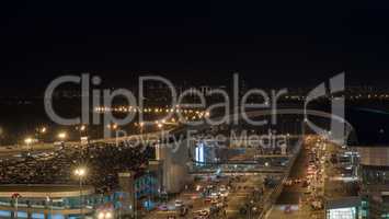 Busy car traffic in night illuminated city