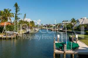 Blue sky over a riverway through Marco Island in Naples