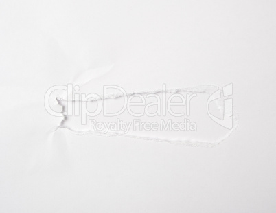 white sheet of paper with a hole, full frame