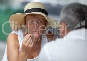 Mature woman in outside cafe