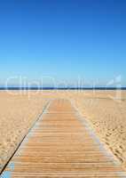Empty beach and wooden path