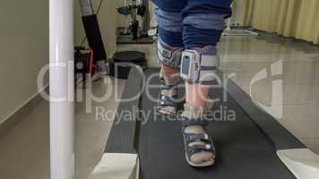Child with foot drop system walking on the treadmill