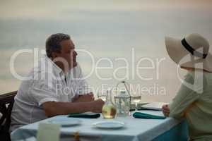 Romantic evening for mature couple in the seafront restaurant