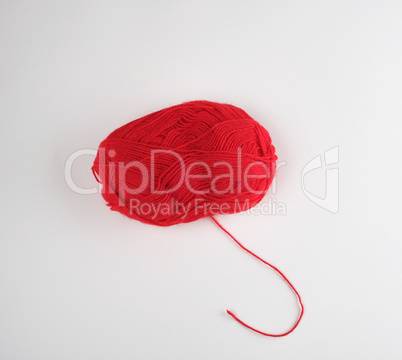 big skein of red wool on a white background