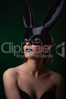 Sexy girl in a black bunny mask