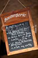 Blackboard Sign in the Window of French Boulangerie