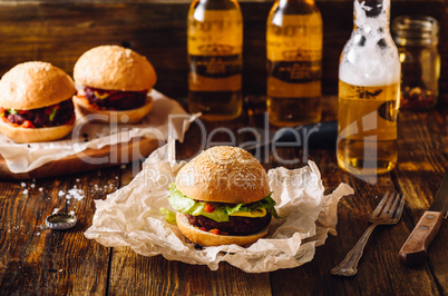 Burgers with Bottles of Lager.