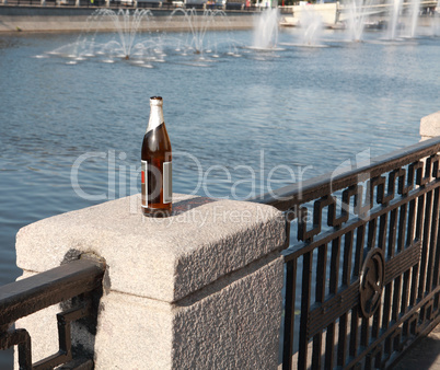 bottle on fence