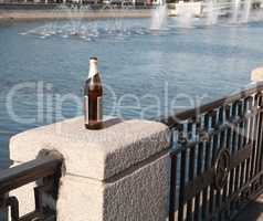 bottle on fence